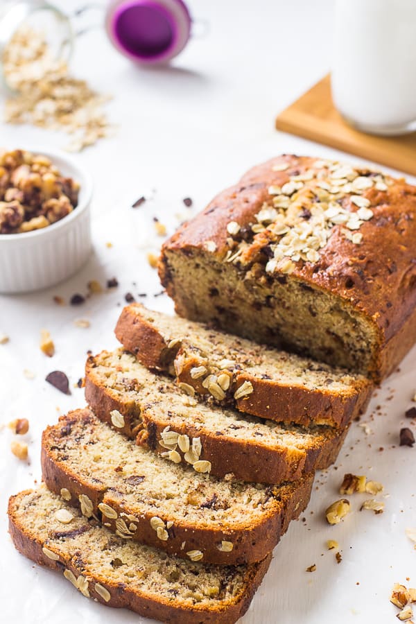 Sliced banana bread on a white table top.