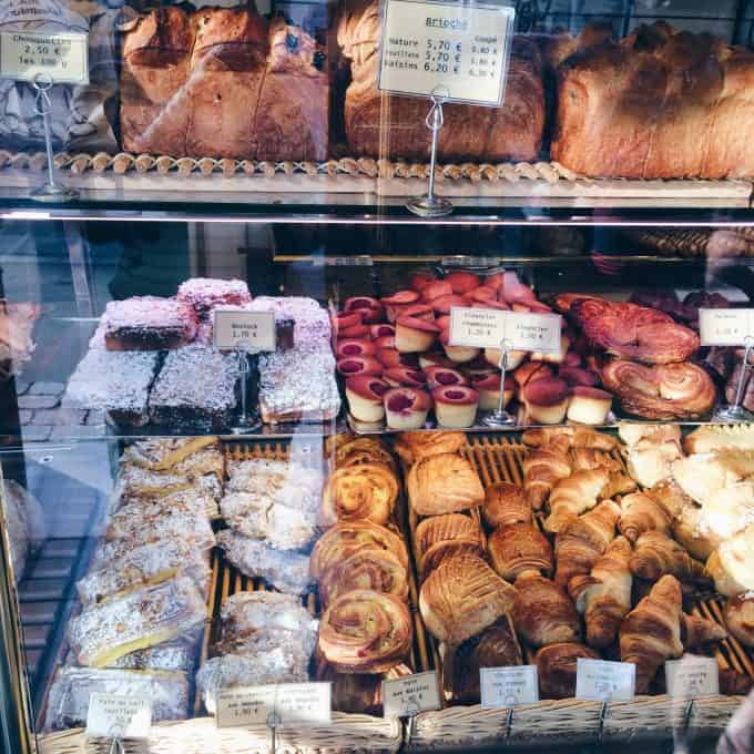 A patisserie shop window with pastries.