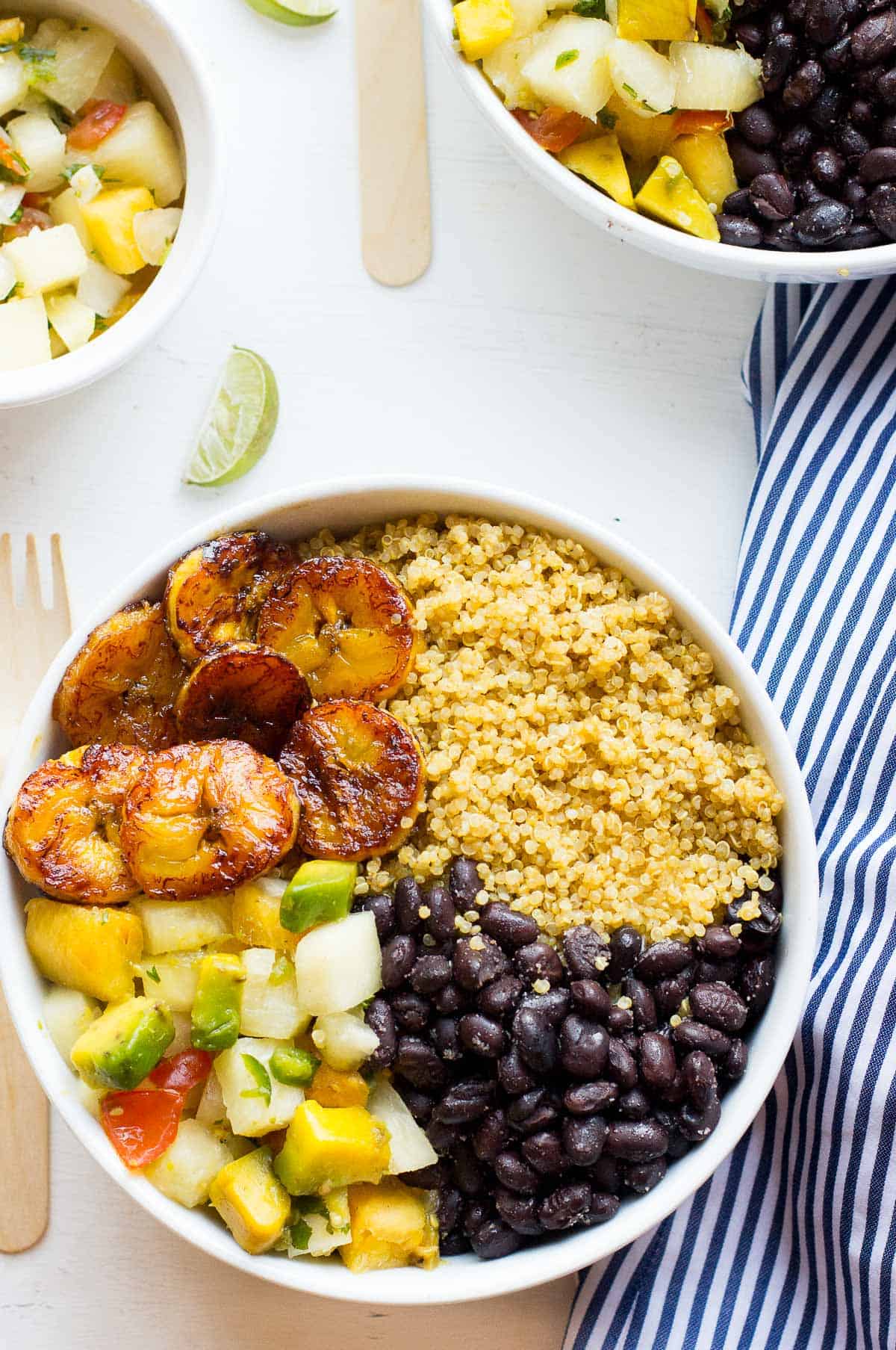 Top down shot of a quinoa bowl on a white table. 