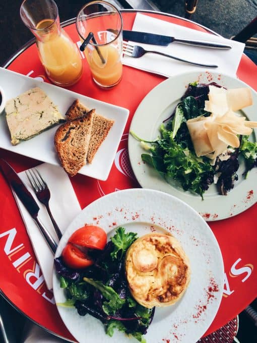 Top down shot of plates of food in a french restaurant. 