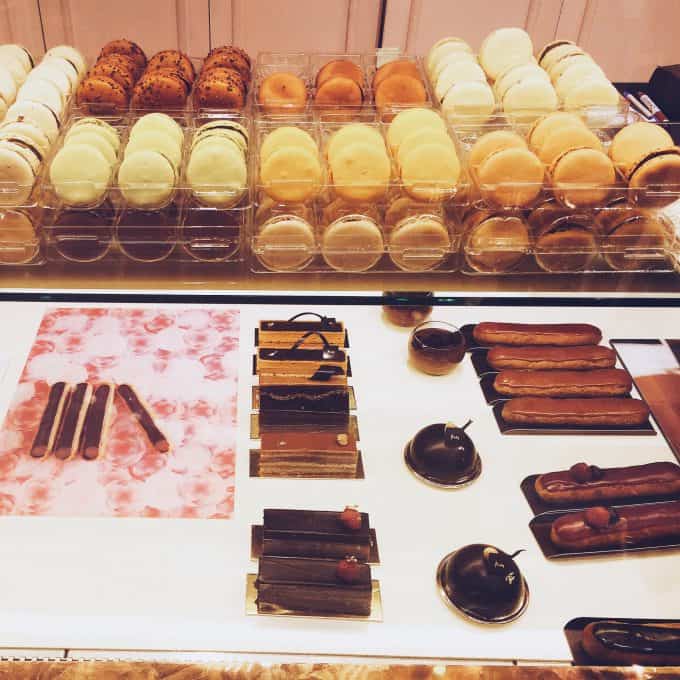 Rows of chocolate treats in a chocolate shop.