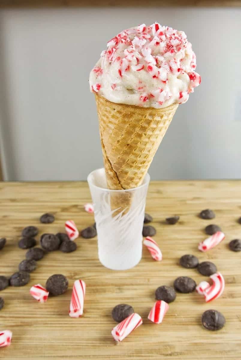 Banana ice cream in a cone with crushed candy cane. 