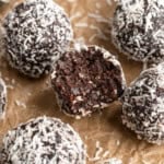 No bake brownie energy bites with bite taken out of one in the center.