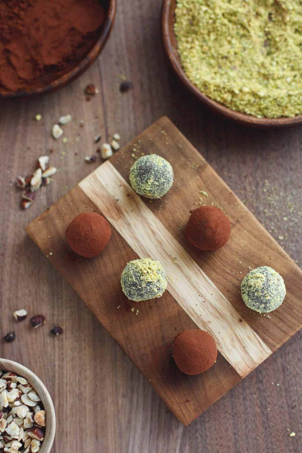 Top down shot of healthy nutella truffles on a wood board.