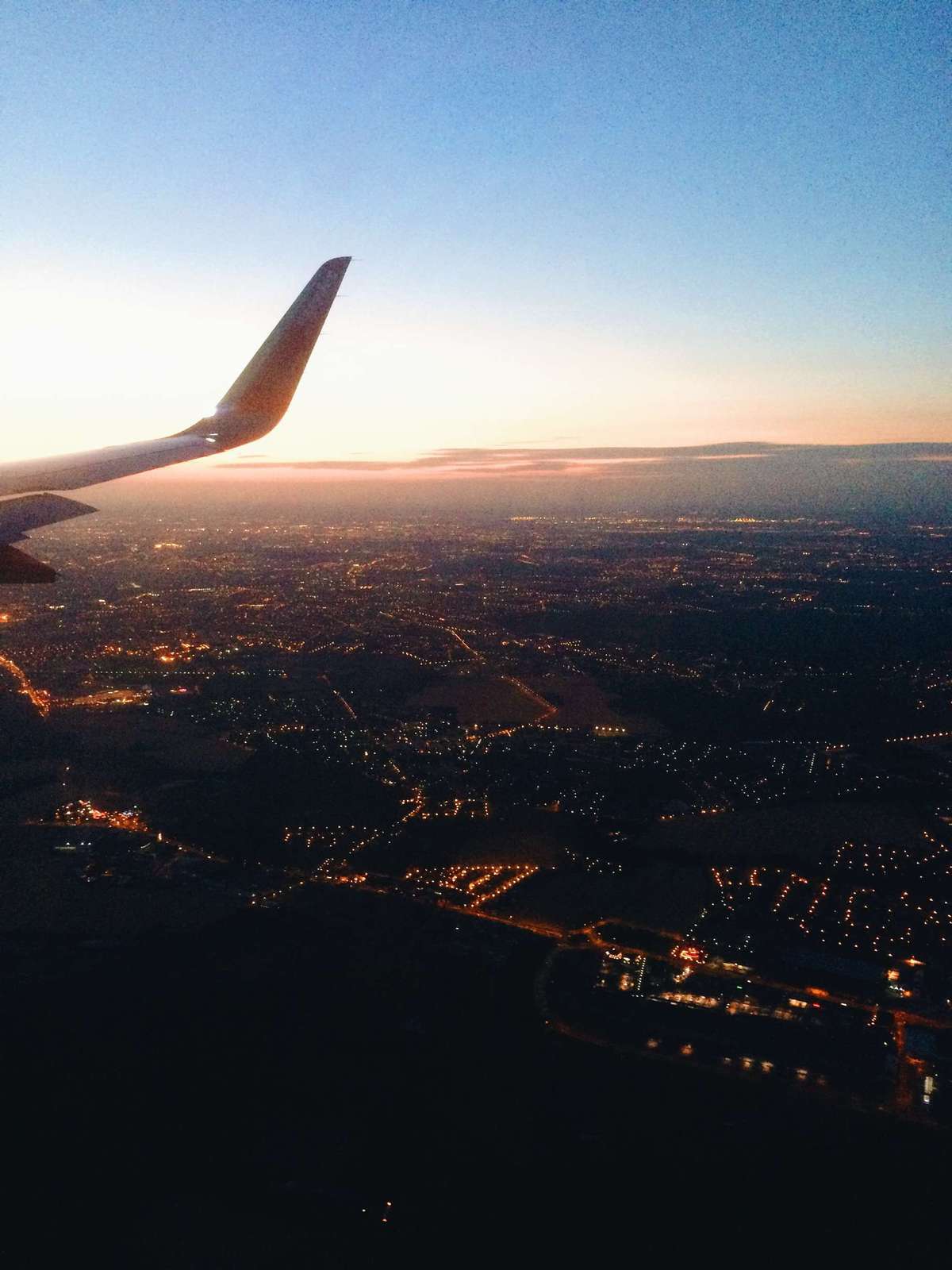 Shot from an airplane looking down onto a city.