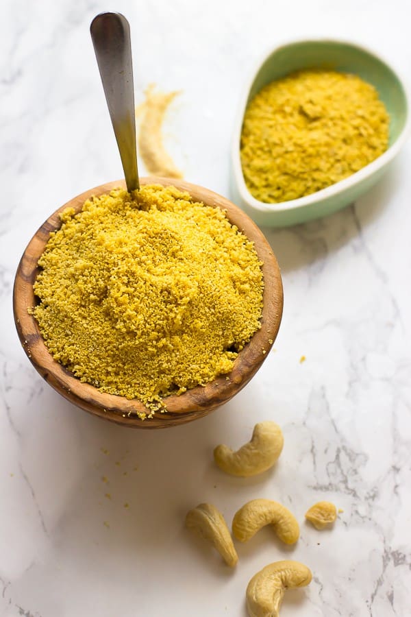 Vegan parmesan cheese in two small bowls