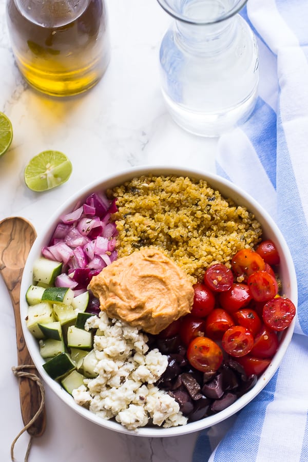 Overhead shot of Mediterranean salad bowl with a wedge of lime on the side. 