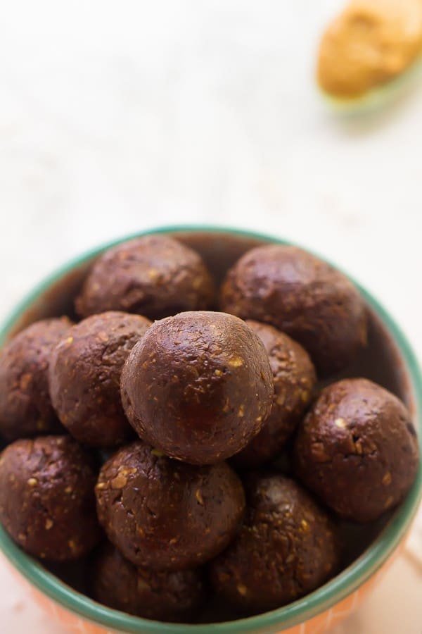 Close up of chocolate peanut butter energy bites in a bowl. 