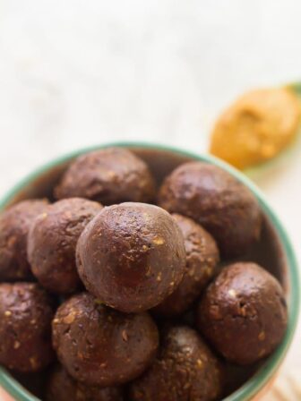 A batch of chocolate peanut butter energy bites in a bowl.