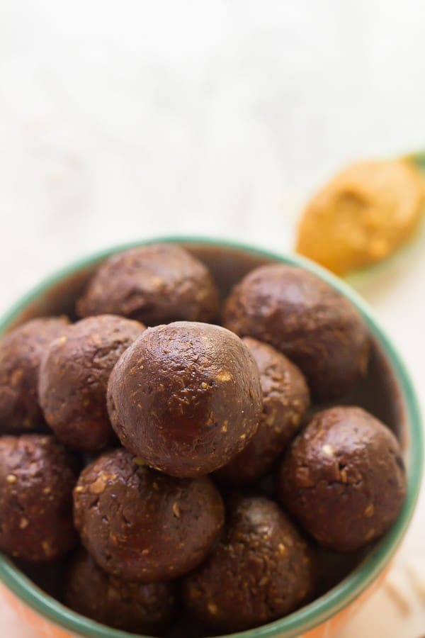 A bowl of no bake chocolate peanut butter energy bites.
