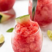 Side on shot of watermelon granita in a glass.