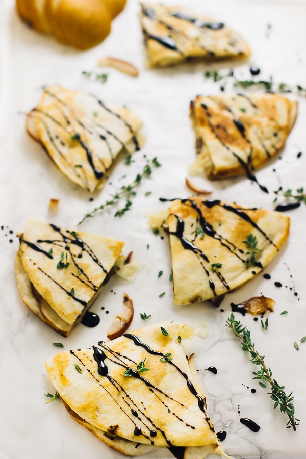 Overhead shot of quesadillas drizzled with a balsamic glaze.