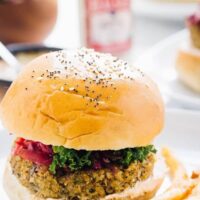 A vegan quinoa cauliflower burger with fries.