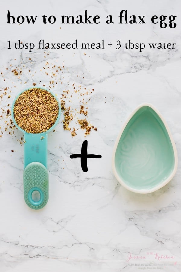 Top down shot of flax seeds in a spoon next to an egg shaped bowl. 