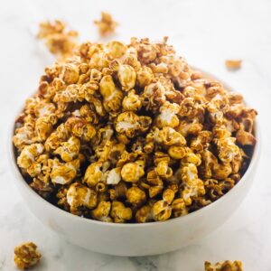 A bowl full of vegan salted caramel popcorn.