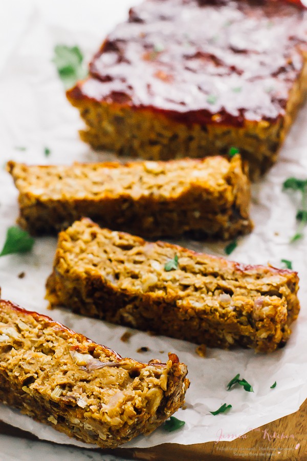 Slices of vegan meatloaf on parchment paper. 