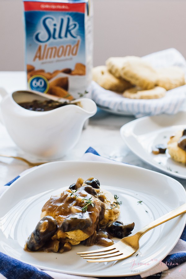 Vegan mushroom gravy on a white plate with a fork on the side. 