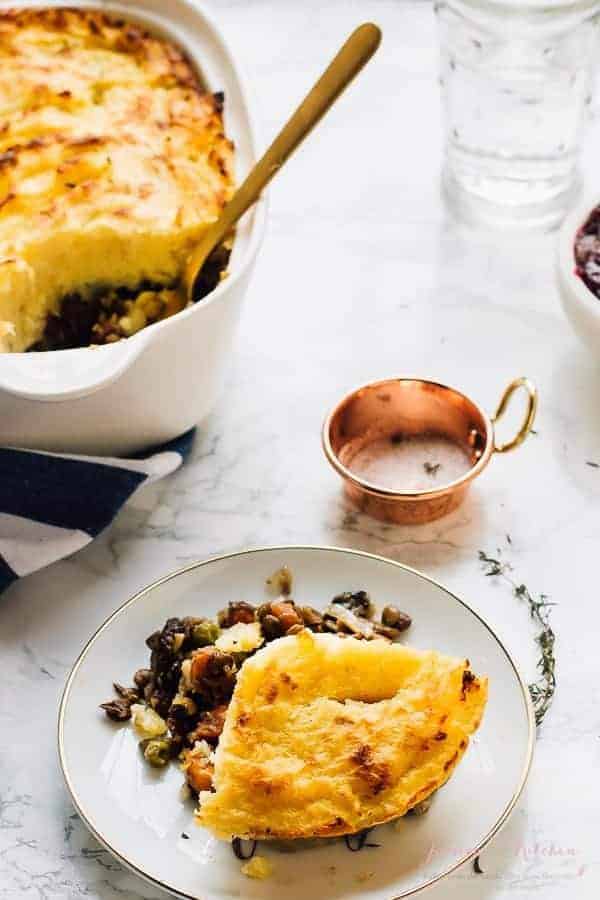 Vegan shepherd's pie on a plate and in a baking dish. 