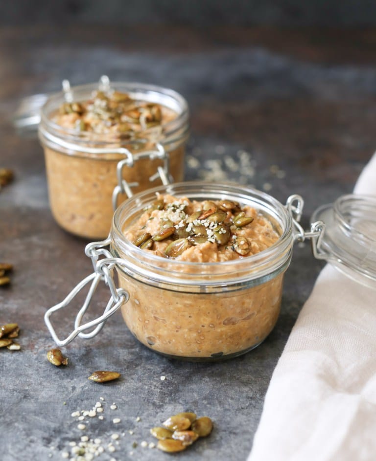 Two small glass containers full of overnight oats.