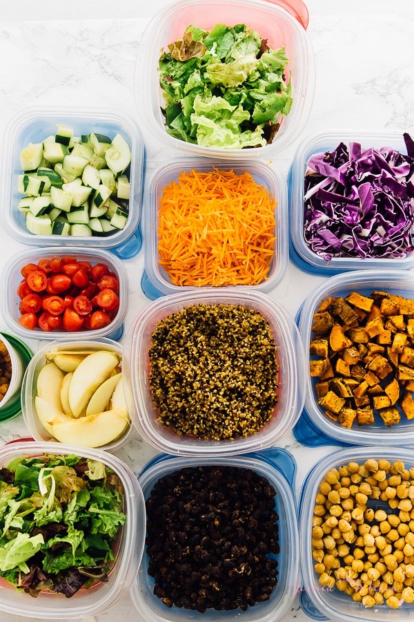 Top down shot of ingredients in tupperware containers.