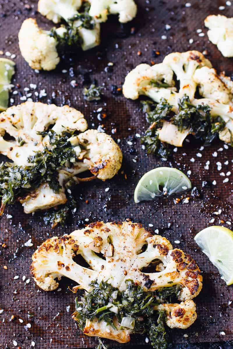 Overhead shot of za'atar roasted cauliflower steaks on a baking sheet.