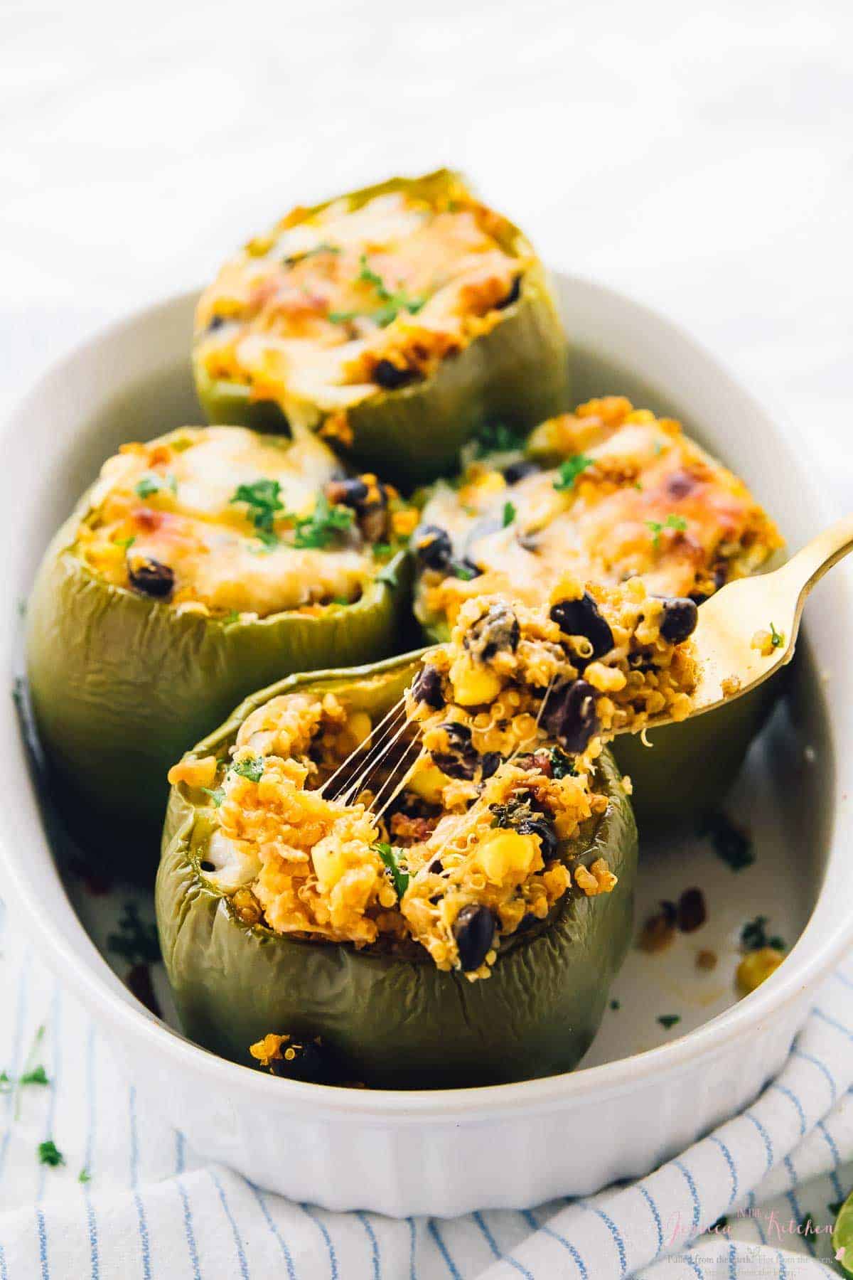 These Easy Quinoa Stuffed Peppers are made Tex-Mex Style! They are very filling, nutritious, and perfect for quick weeknight dinners! via https://jessicainthekitchen.com