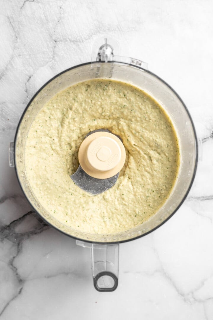 Food processor with roasted garlic white bean dip.