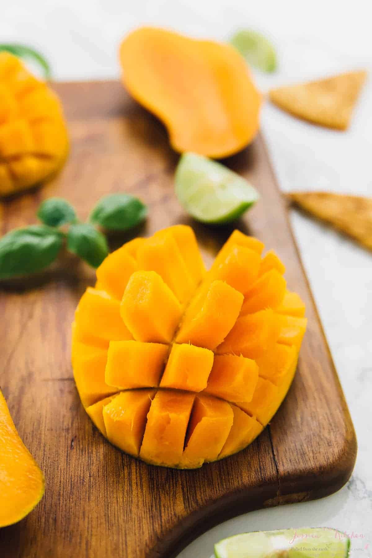 Closeup of cut mango on cutting board