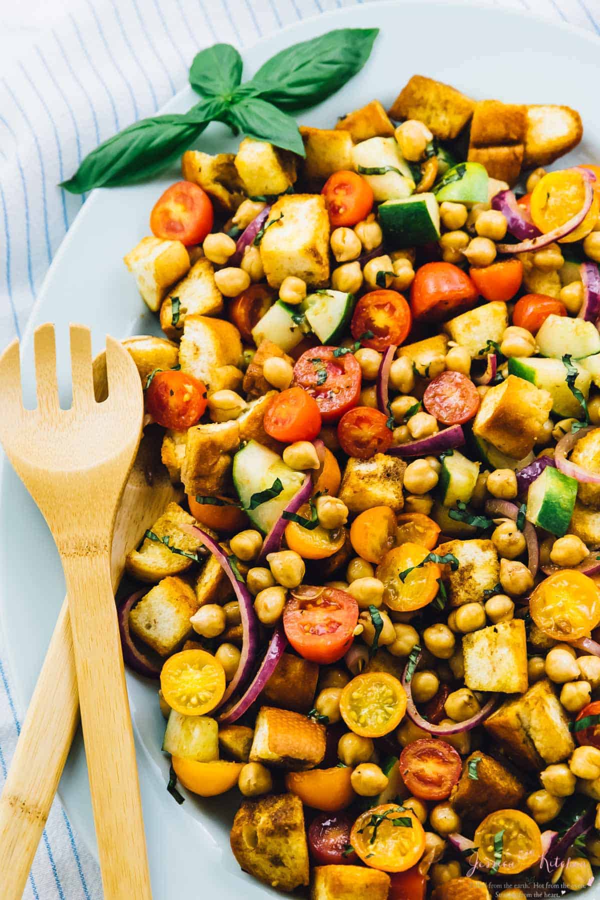 Overhead view of chickpea salad, with a spork on the side. 