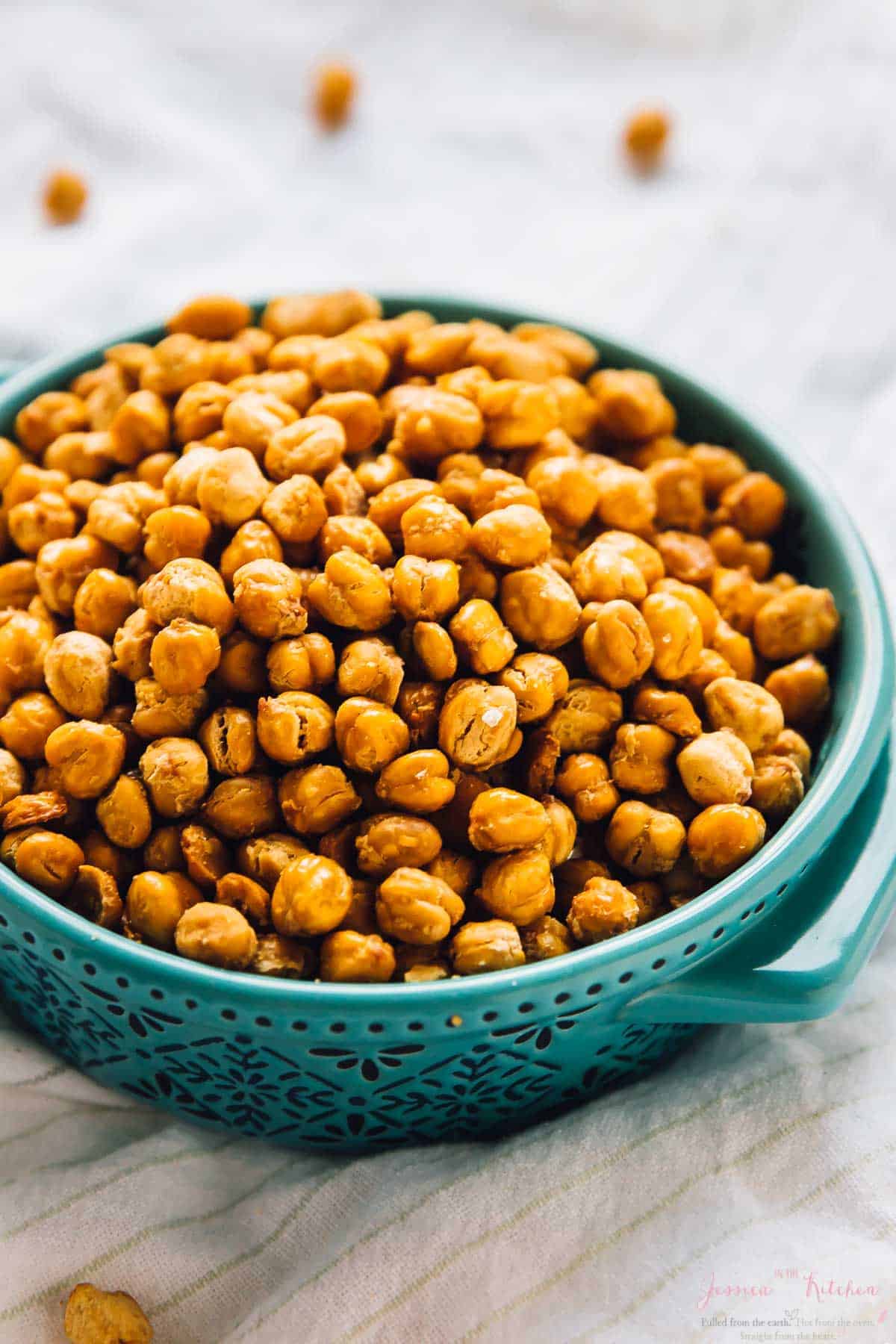 Crispy chickpea in a blue bowl on a cloth. 