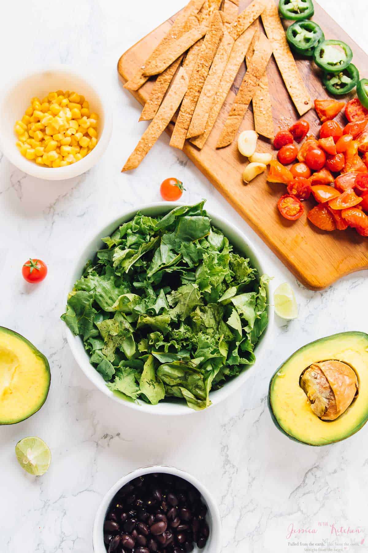 Overhead shot of ingredients for loaded taco salad bowls. 