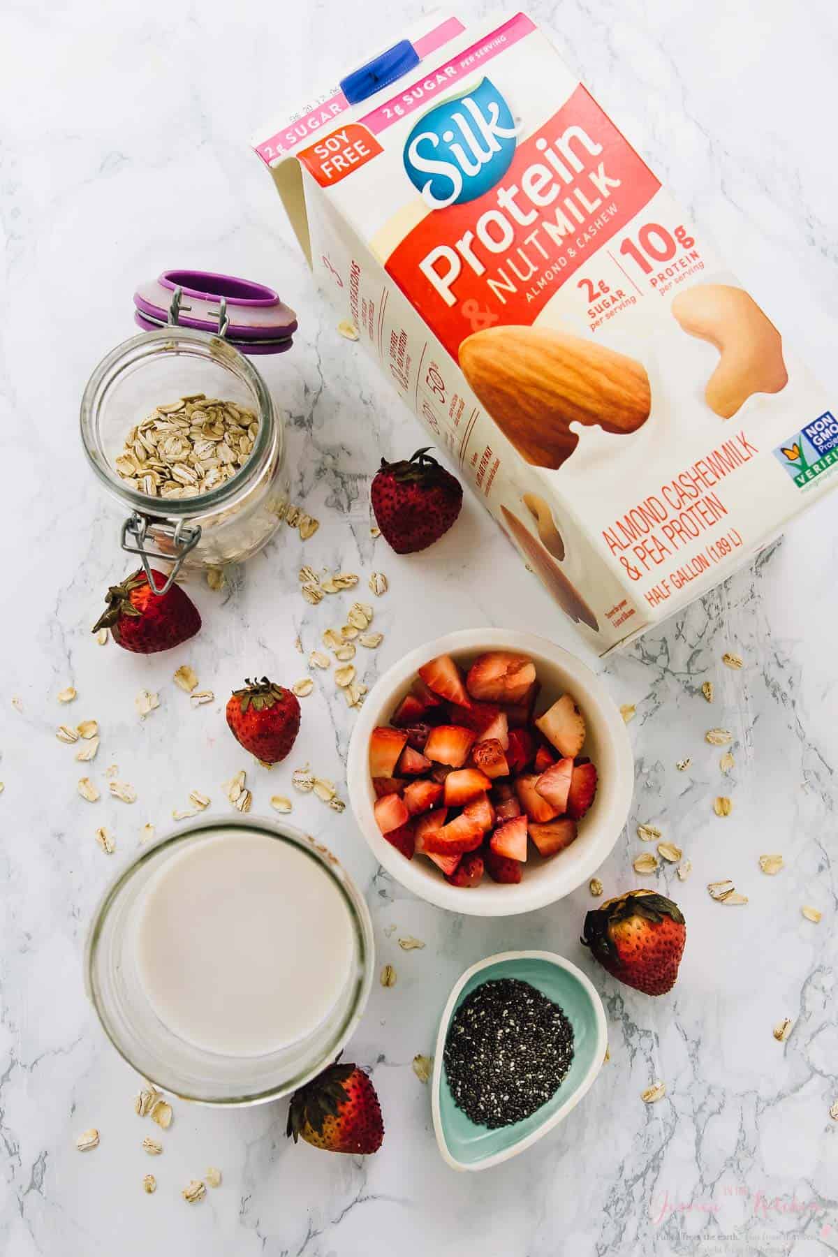 Overhead view of ingredients for strawberry coconut overnight oats