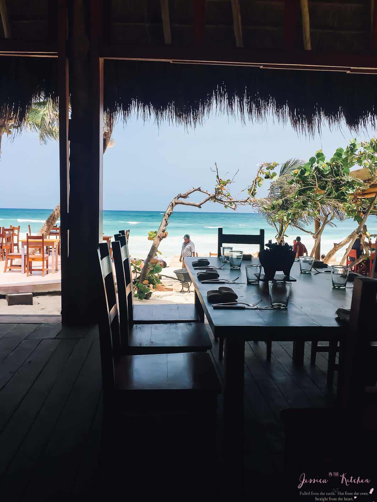 Inside a restaurant looking out to the beach.