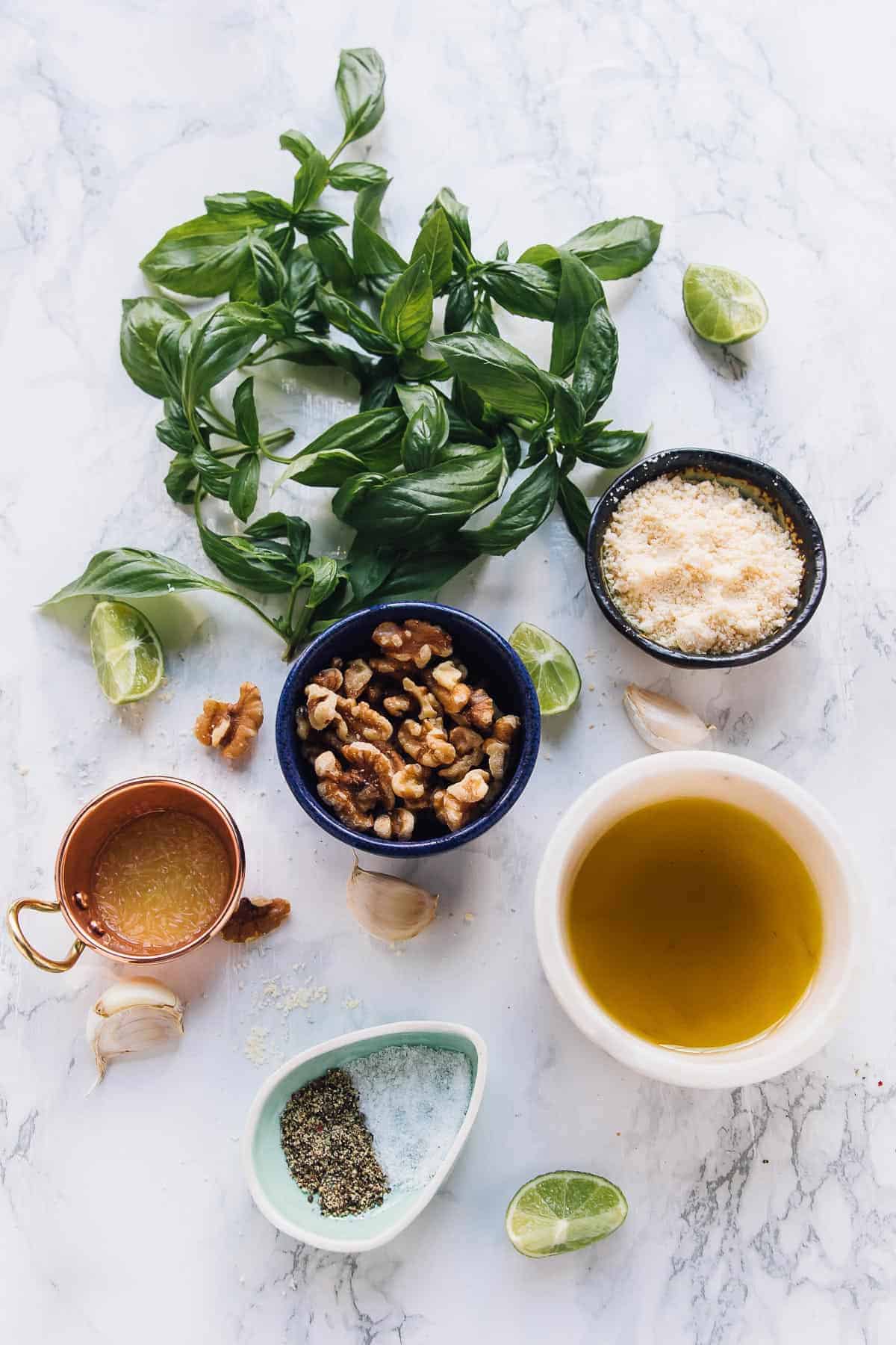 Top down view of ingredients for pesto. 