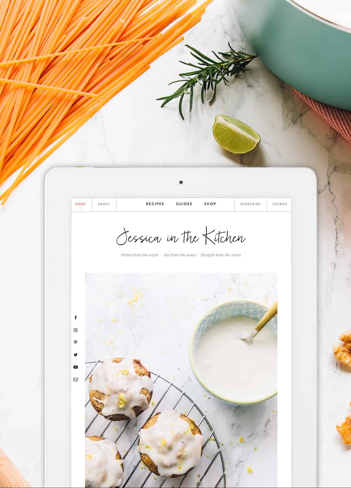 Overhead shot of e tablet with jessica in the kitchen website on it.