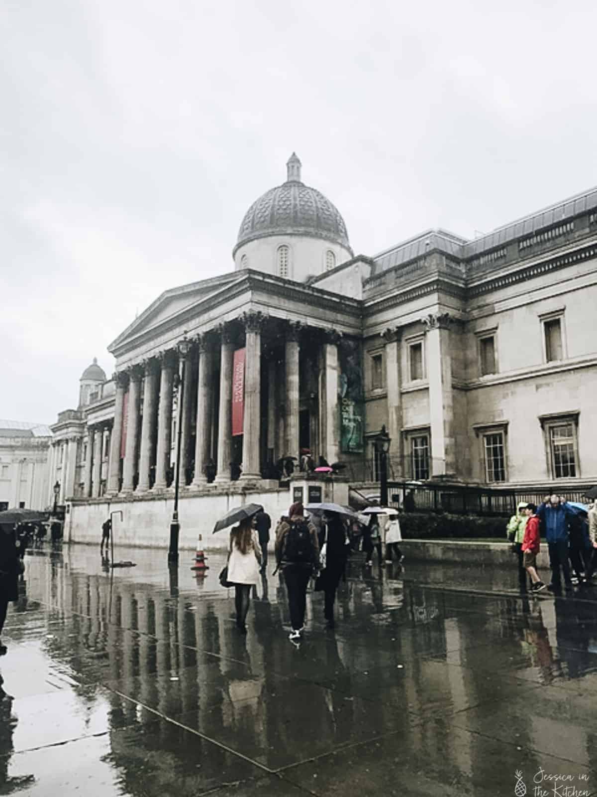 Exterior shot of natural history museum in the rain.