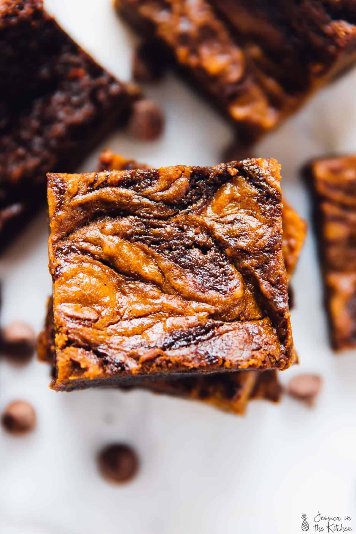 Close up overhead view of a stack of brownies with cheesecake swirls