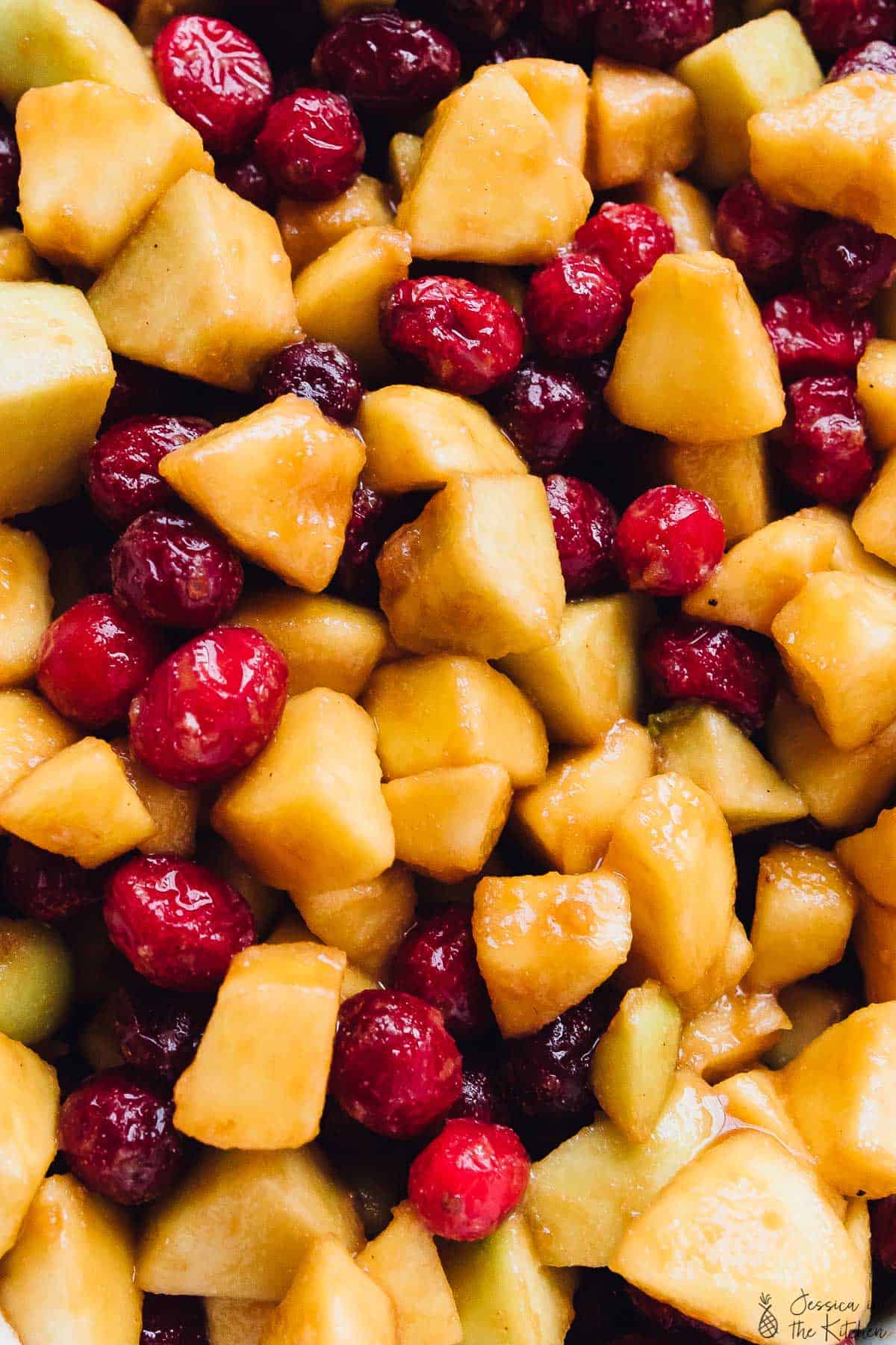 Close up of diced apples and cranberries. 