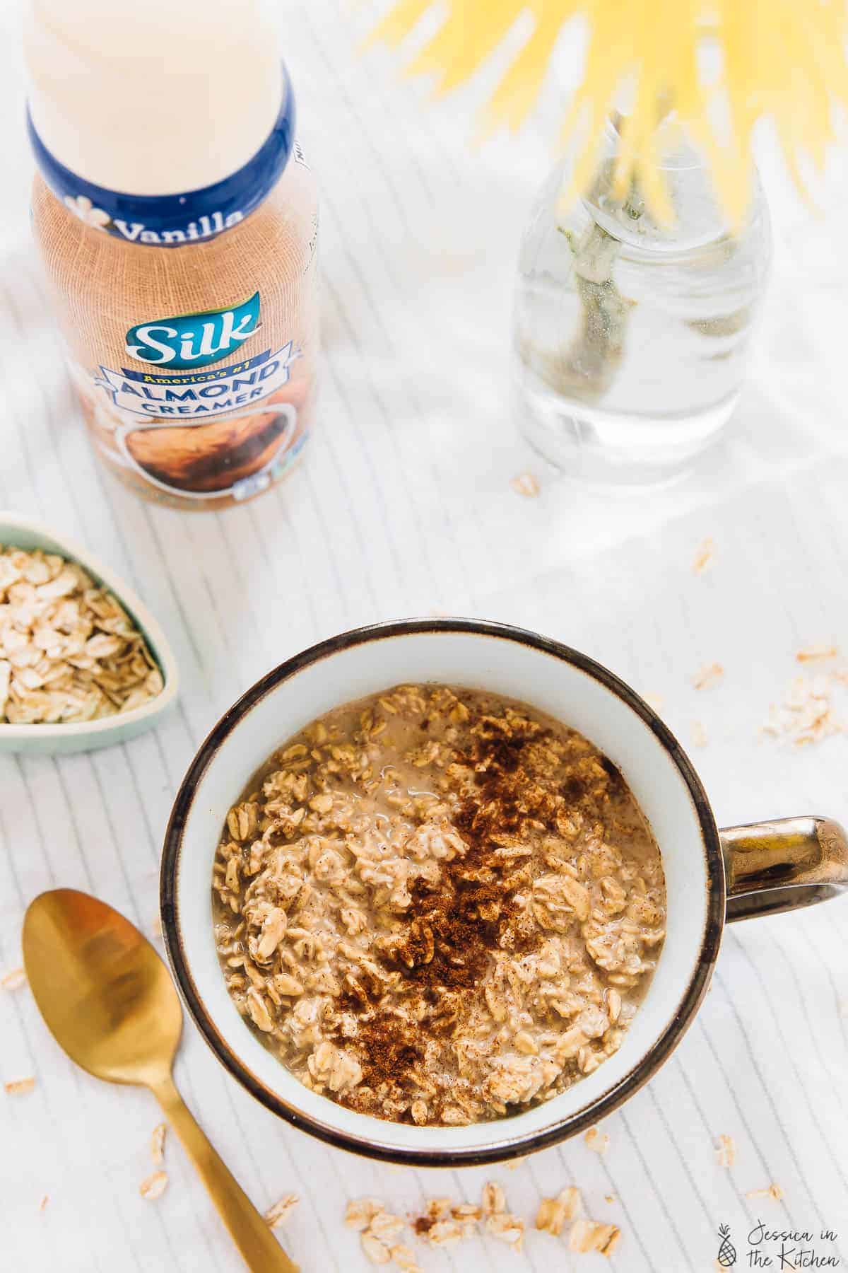 Top down view of espresso cinnamon overnight oats in a white cup. 