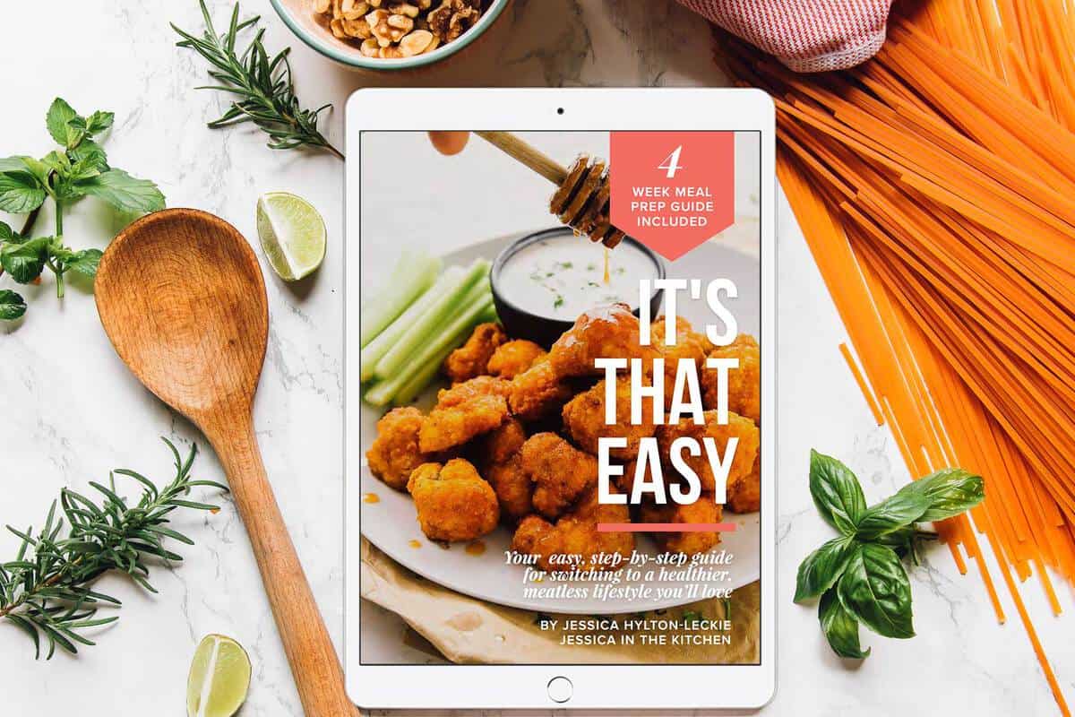 E tablet on a table with picture of cauliflower wings on it. 