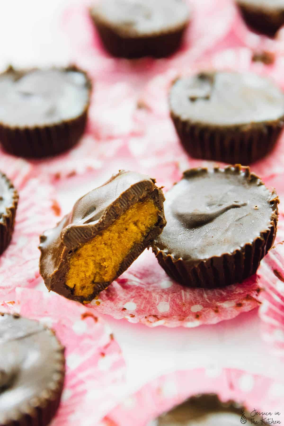 Chocolate cups cut in half on paper muffin liners.