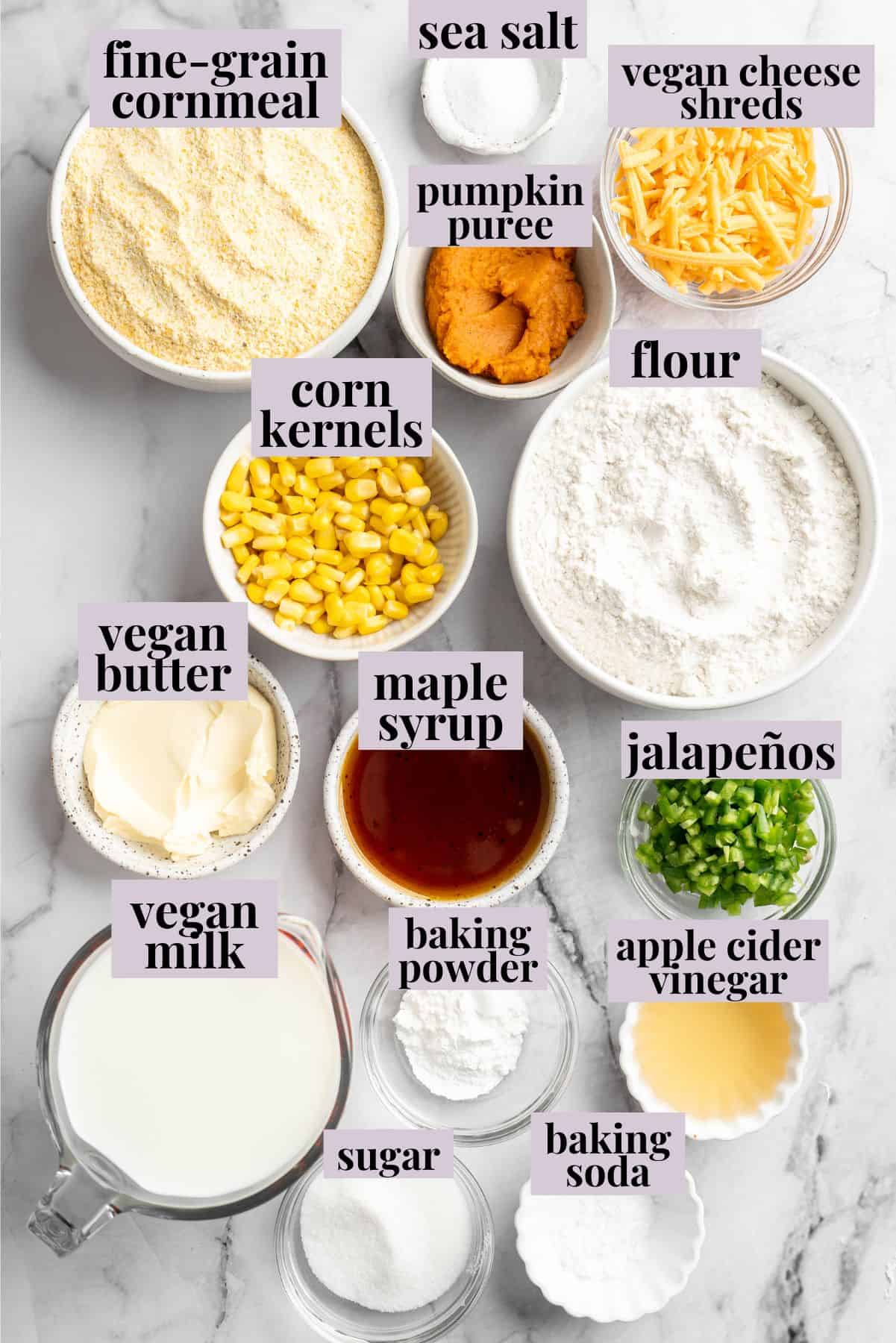 Overhead view of ingredients for pumpkin cornbread with labels