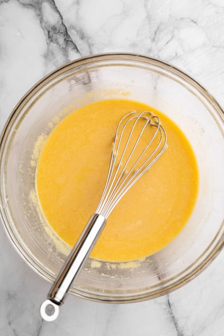 Wet ingredients for vegan pumpkin cornbread in bowl
