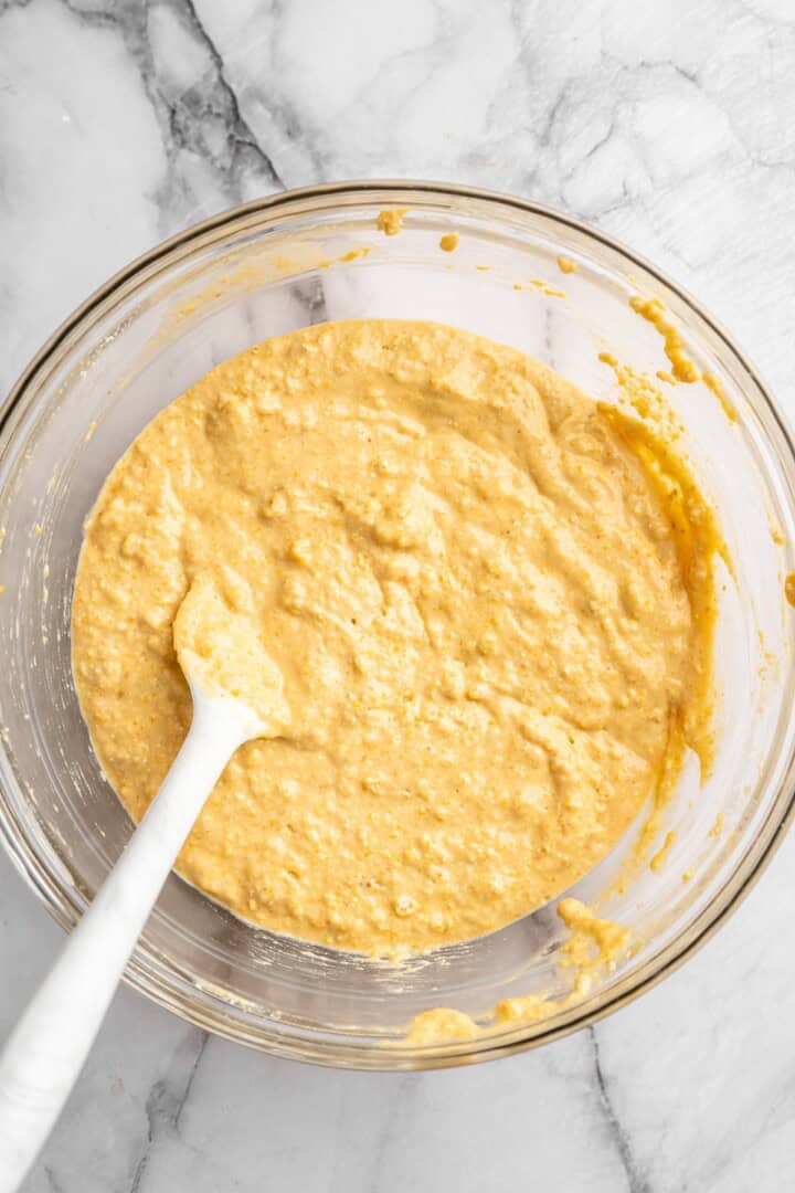 Pumpkin cornbread batter in bowl