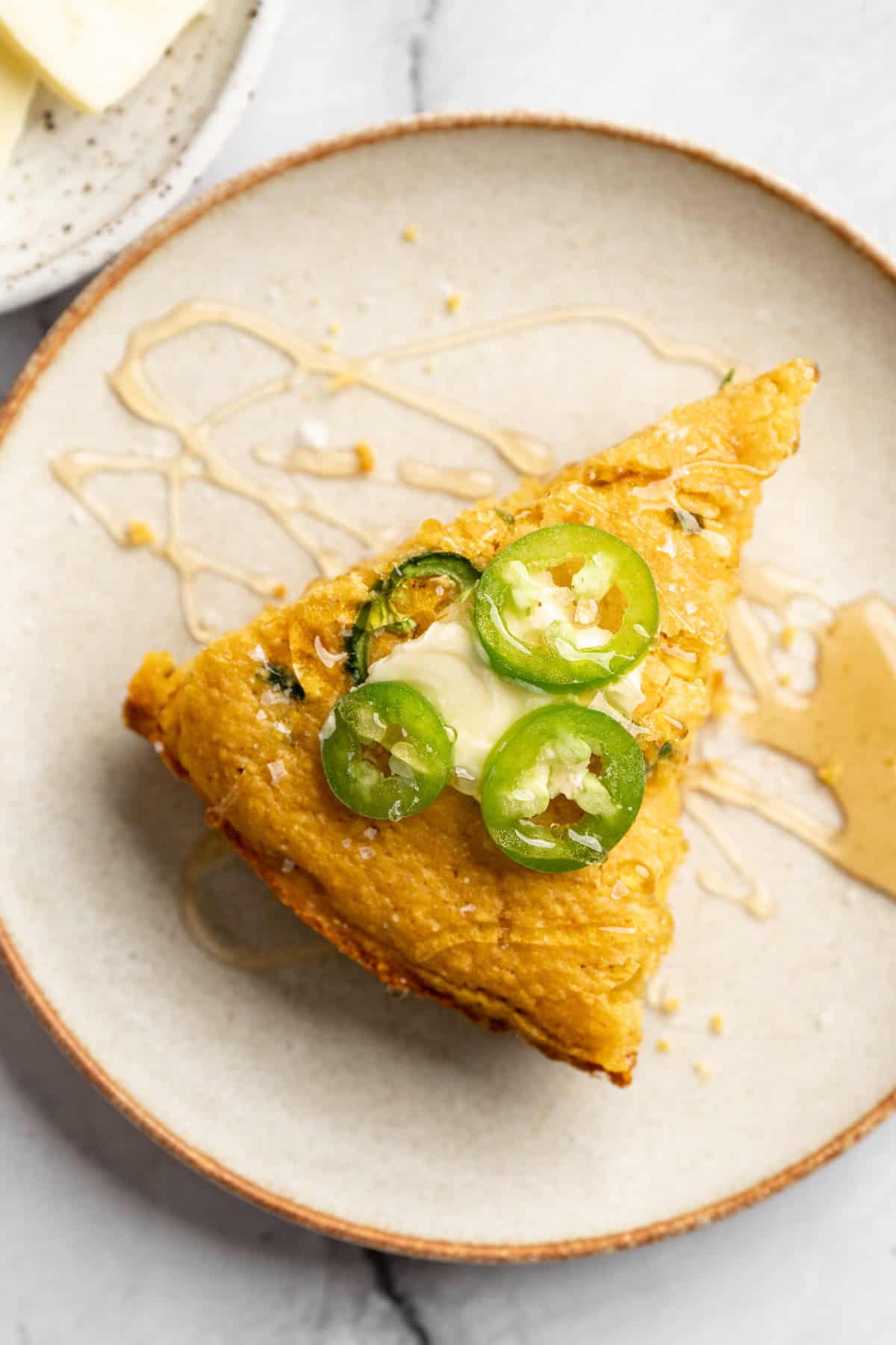 Slice of pumpkin cornbread on plate