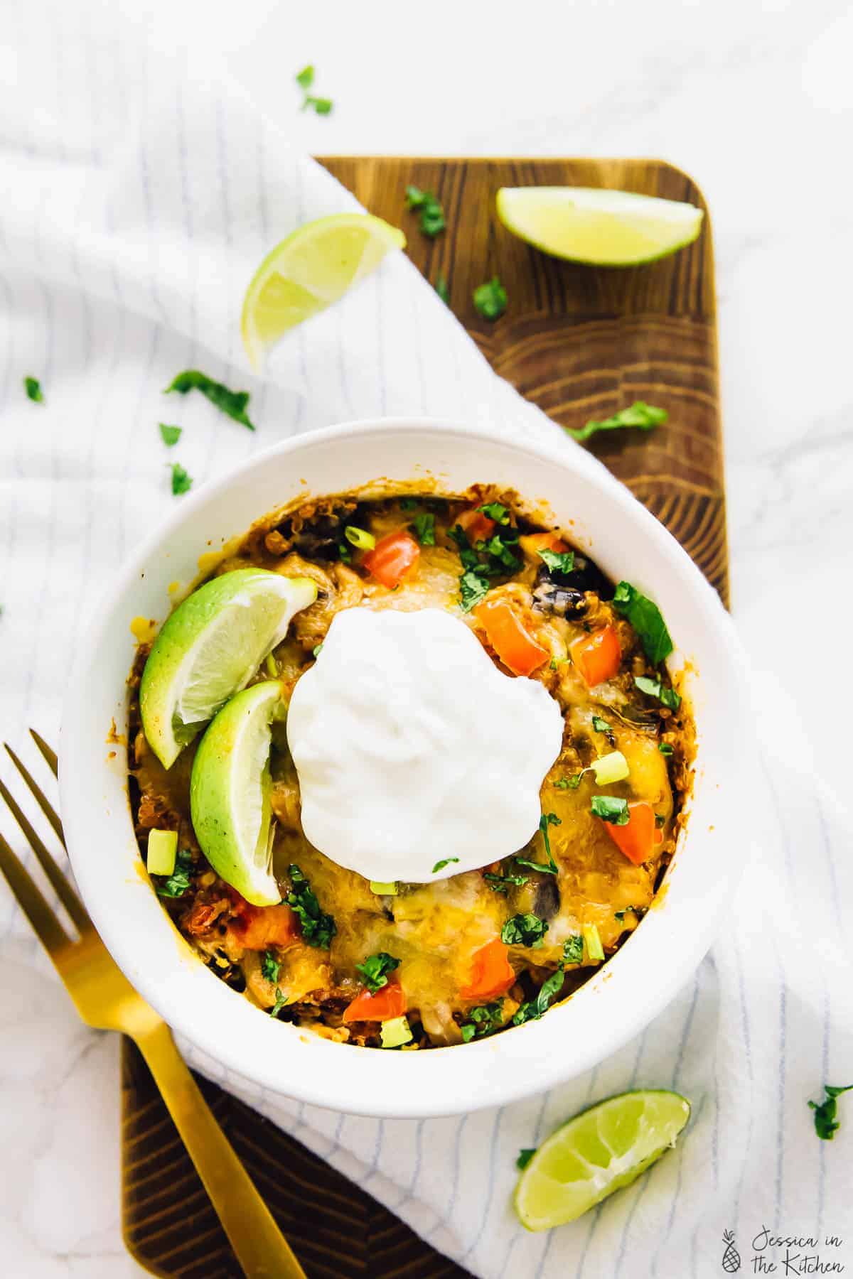 Overhead view of slow cooker quinoa enchilada casserole in a ramekin. 