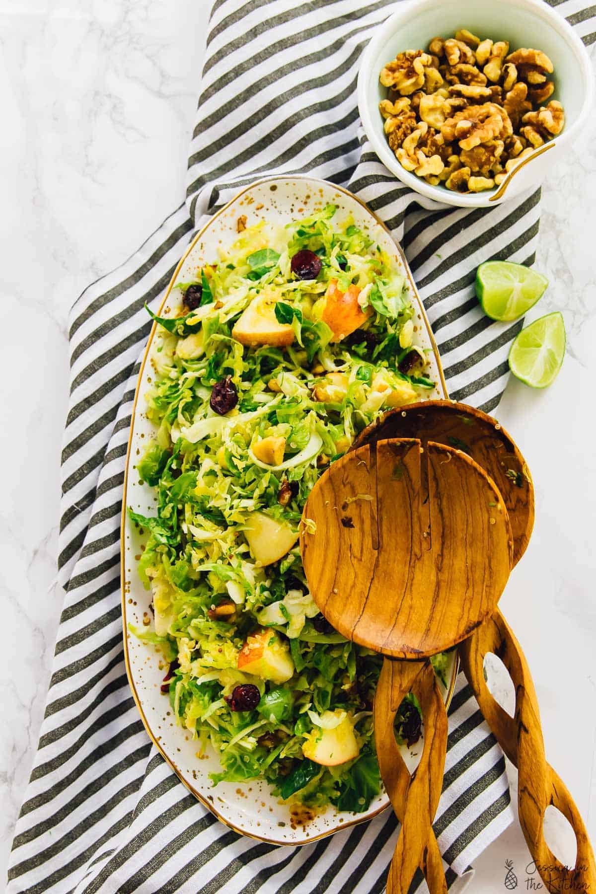 Overhead view of quinoa and apple salad on a long plate. 