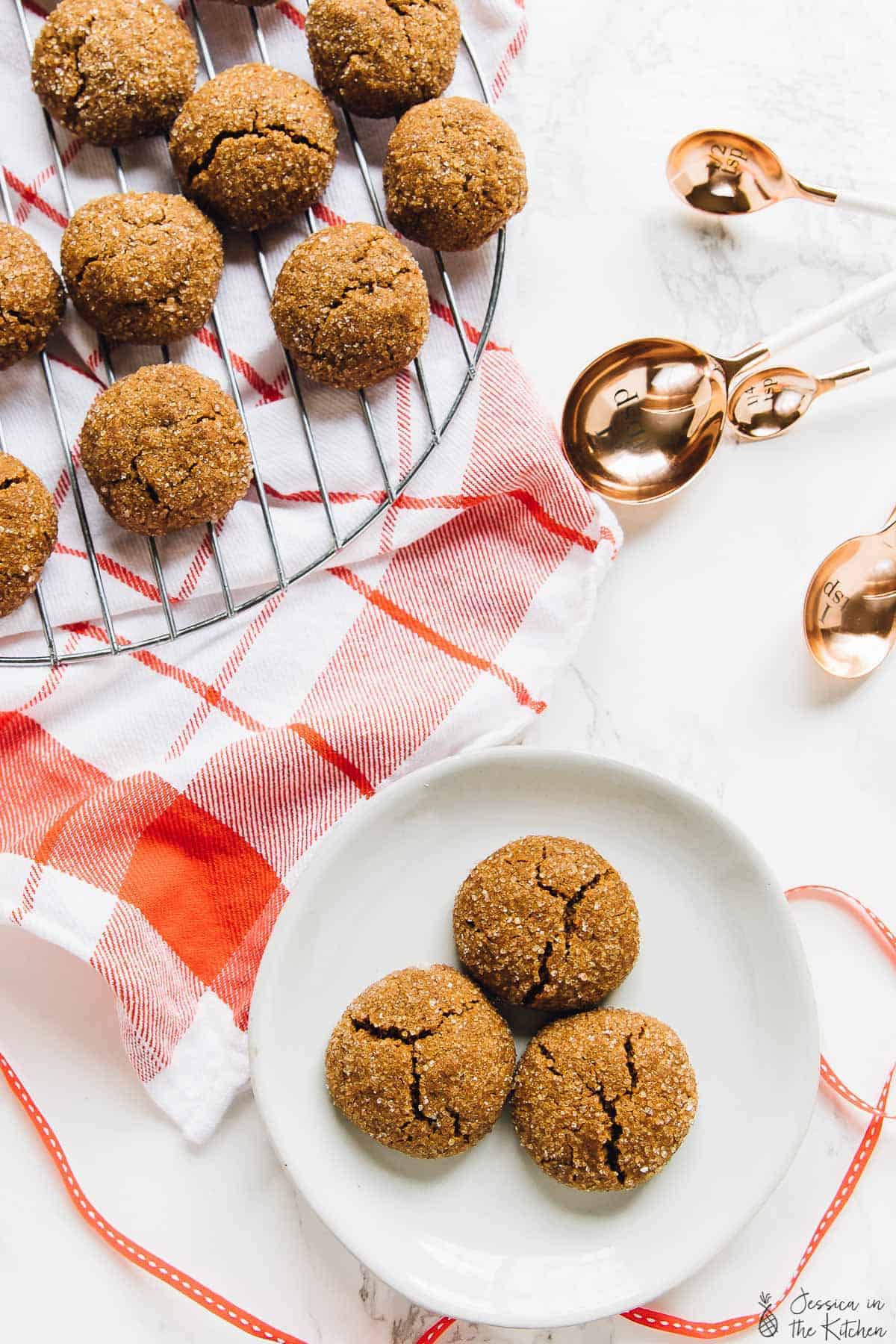 Top down view of molasses cookies on a wire rack. 