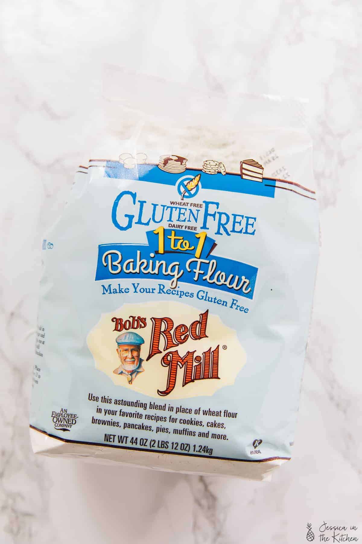 A pack of gluten free baking flour on a white backdrop. 