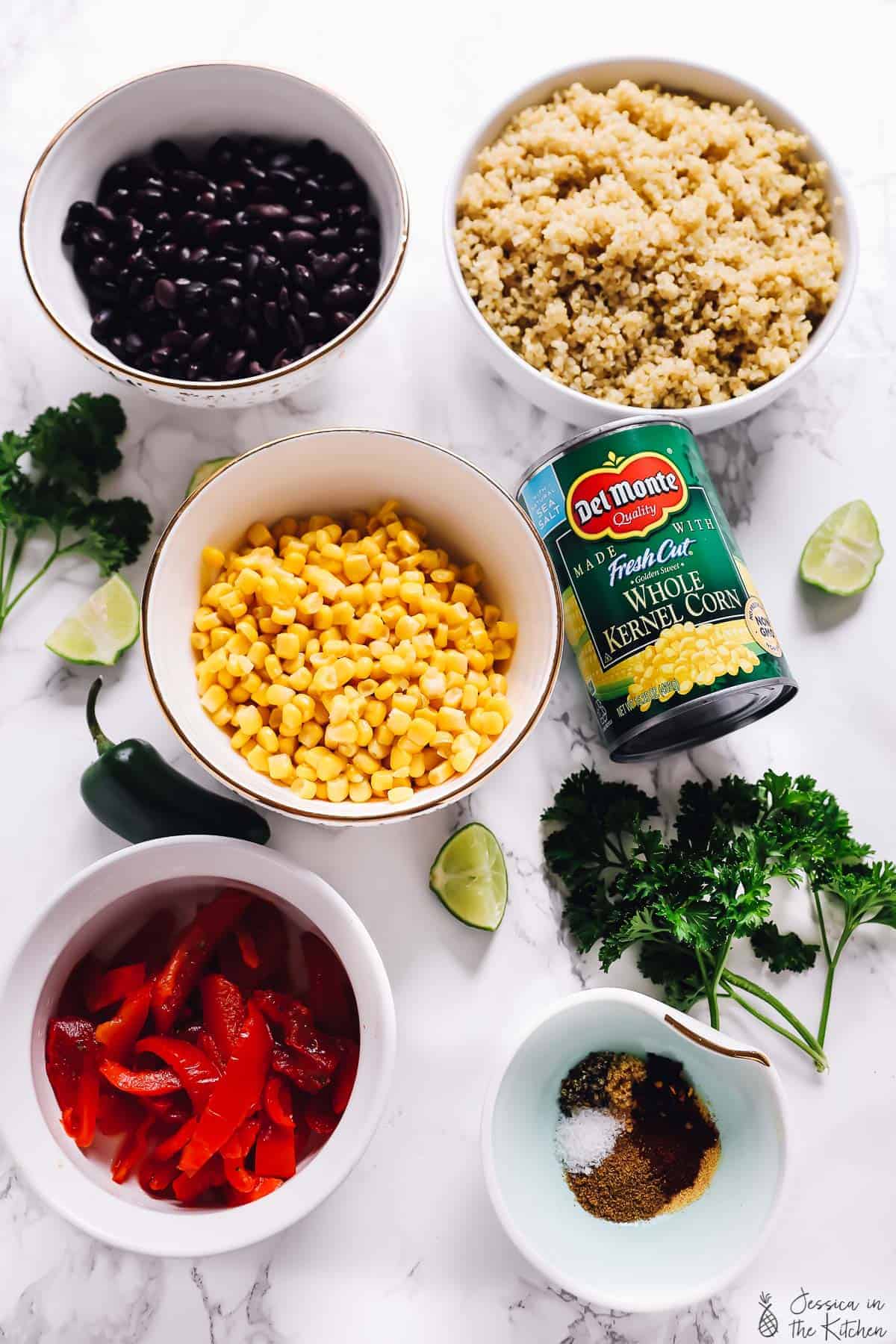 Overhead view of ingredients for Mexican street corn burrito bowls